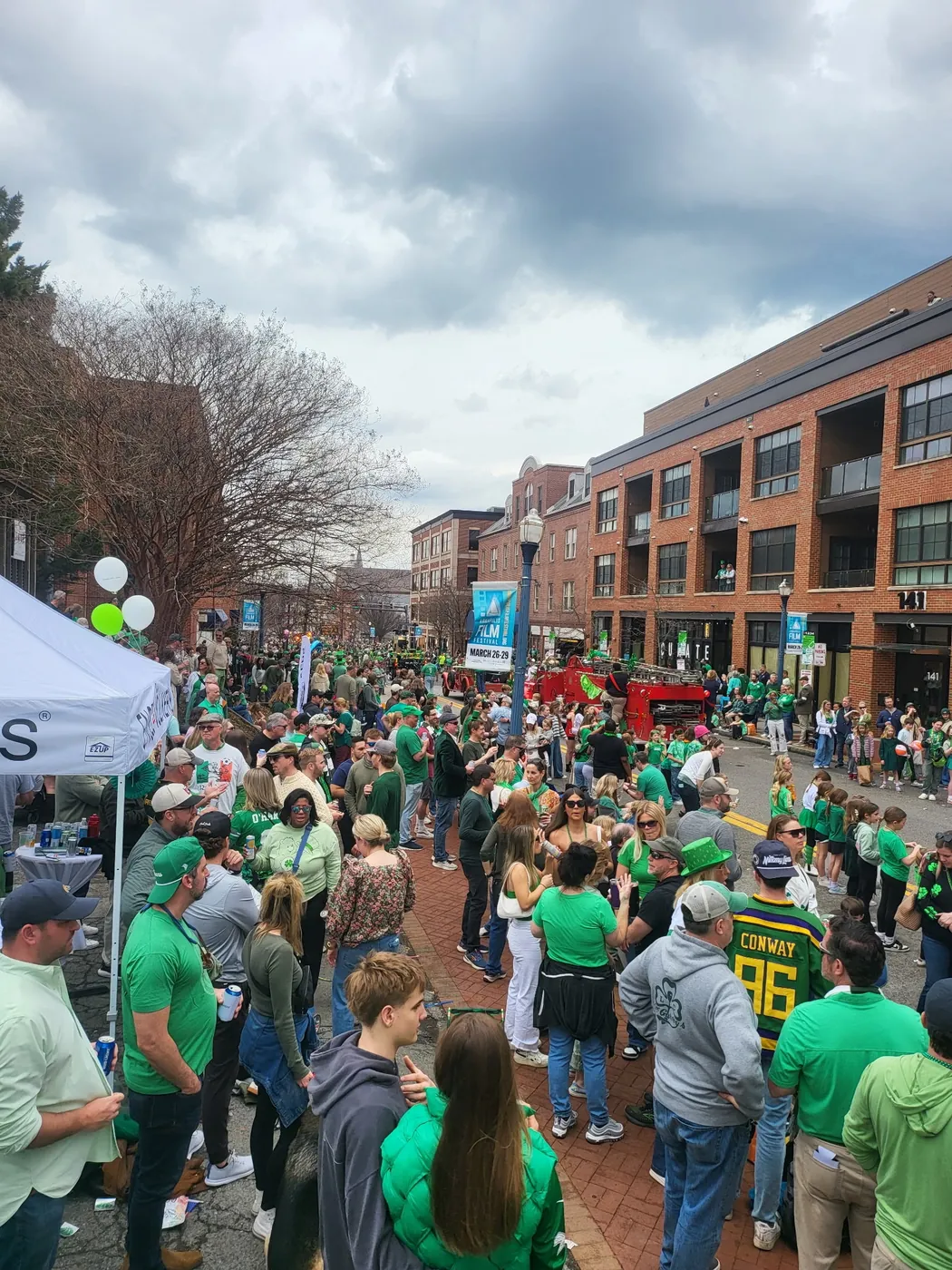 Crowd dressed in green filling a downtown Annapolis street for the St. Patrick's Day parade.